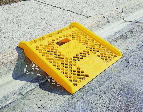 YELLOW PLASTIC CURB RAMP